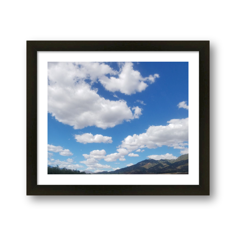 Fictional Clouds Over Mountains